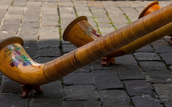 Lucerne Switzerland: Group playing long wooden horns called alphorns: Significant part of Swiss culture: Originally used for communication between shepherds and in ceremonies