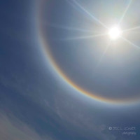 Sun Halo-sunlight bending through microscopic hexagonal ice crystals suspended in high-altitude clouds