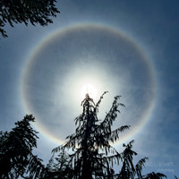 Sun Halo-sunlight bending through microscopic hexagonal ice crystals suspended in high-altitude clouds